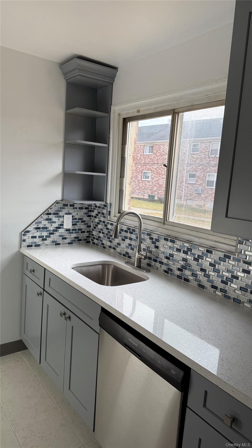 1003 Rottkamp Street, Unit 1 Valley Stream, NY 11580 - Photo 3 of 12 a bathroom with a sink and a mirror