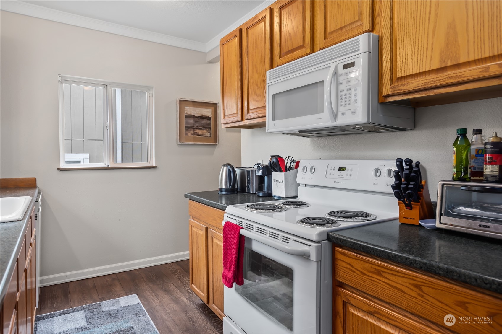6820 Lower Ridge Road Everett, WA 98203 - Photo 10 of 27 a kitchen with stainless steel appliances granite countertop a stove and a microwave