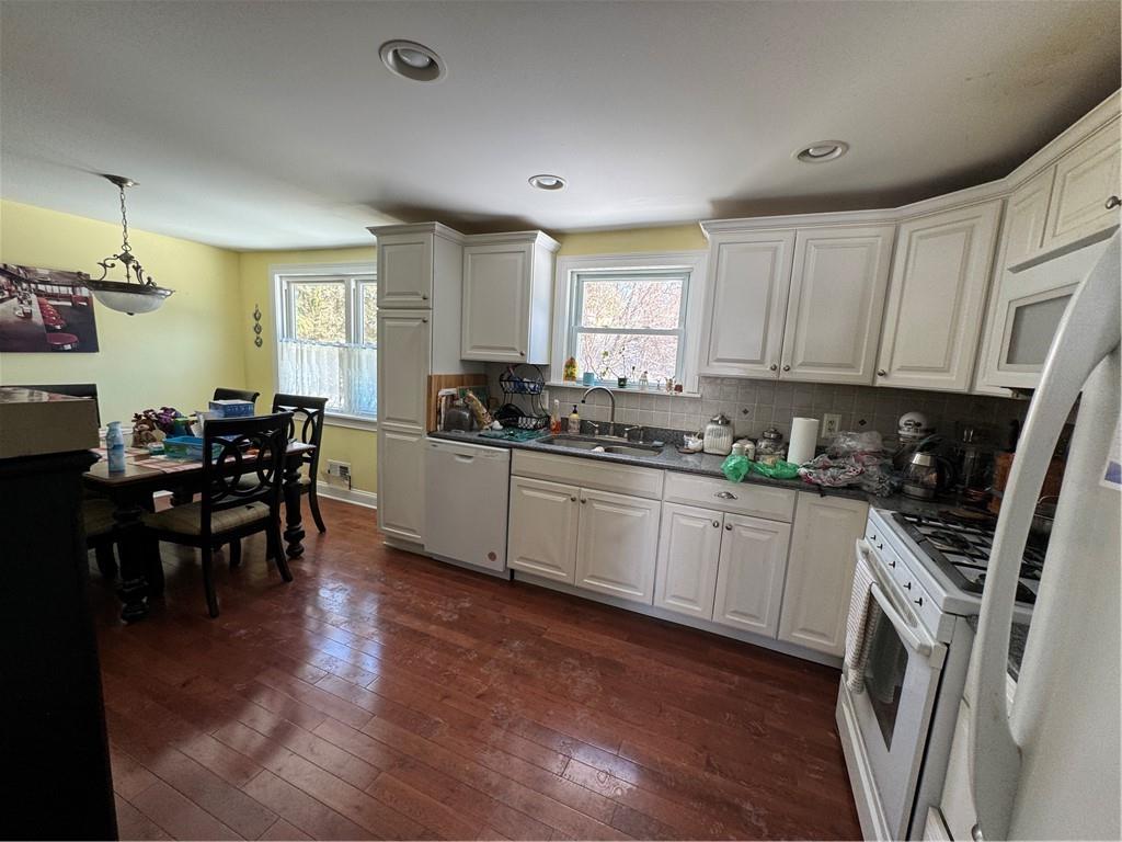 3016 Pitchfork Drive McKees Rocks, PA 15136 - Photo 9 of 26 a kitchen with a sink a window a dining table and chairs