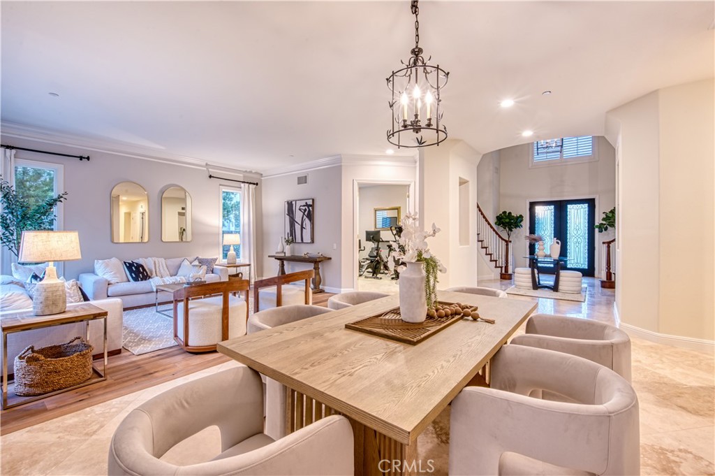 15 Tortoise Shell Coto de Caza, CA 92679 - Photo 13 of 35 a dining room with wooden floor a chandelier a wooden table and chairs
