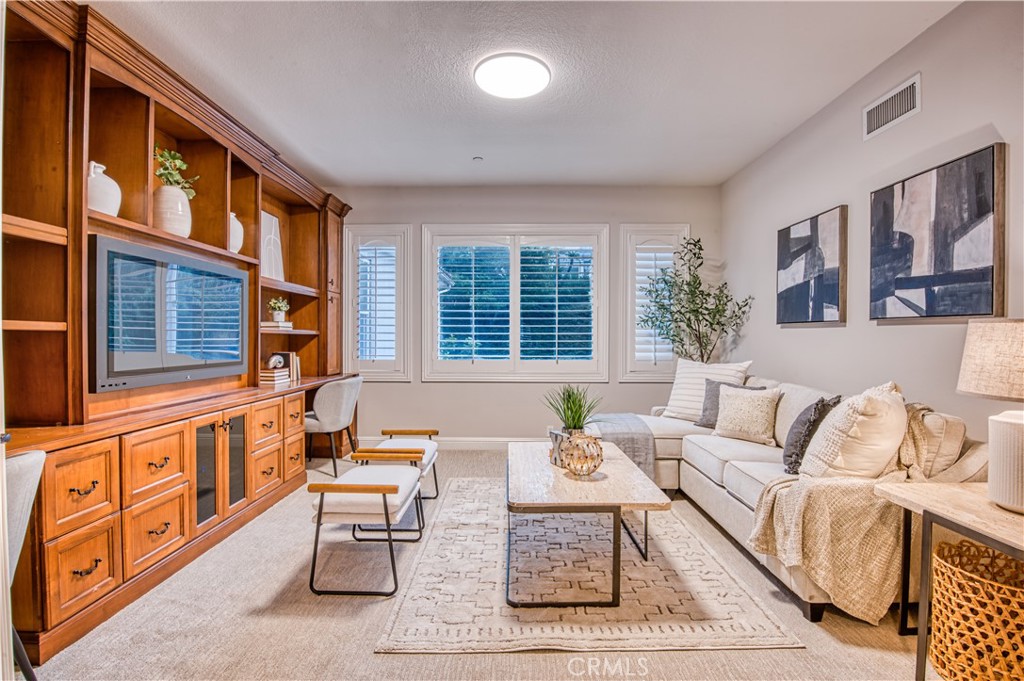 15 Tortoise Shell Coto de Caza, CA 92679 - Photo 16 of 35 a living room with furniture fireplace and a large window
