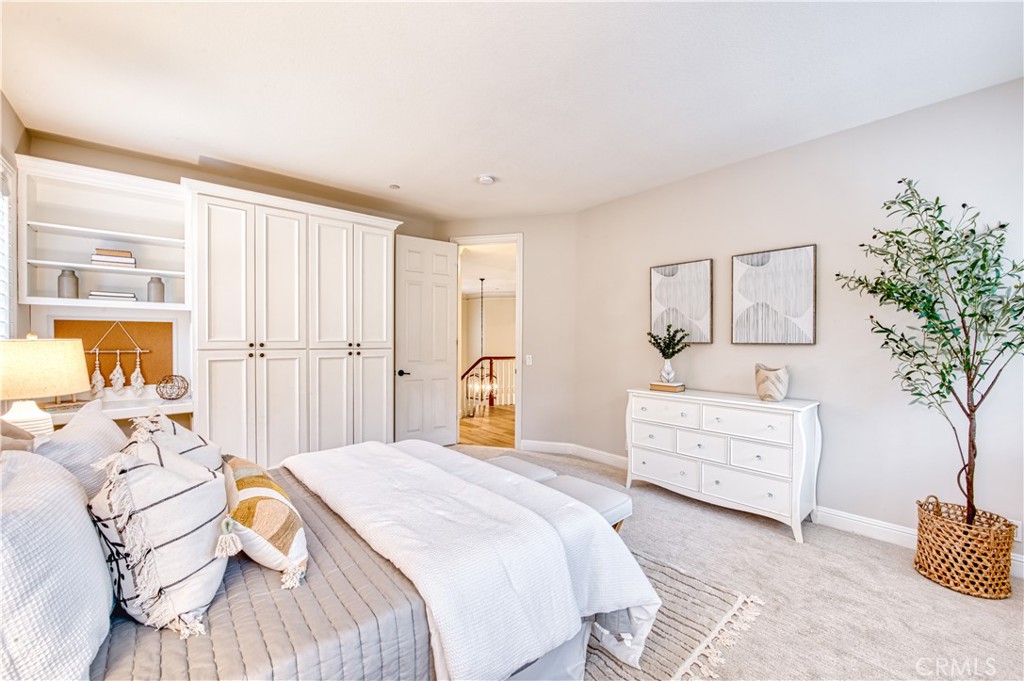 15 Tortoise Shell Coto de Caza, CA 92679 - Photo 21 of 35 a bedroom with a bed and a dresser