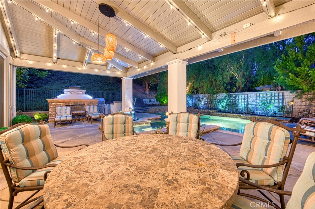 15 Tortoise Shell Coto de Caza, CA 92679 - Photo 28 of 35 a view of a patio with table and chairs potted plants with wooden floor and fence