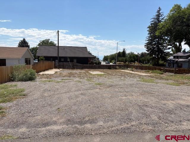 105 Southeast Buffalo Avenue Cedaredge, CO 81413 - Photo 2 of 4 a swimming pool with yard and mountain view in back