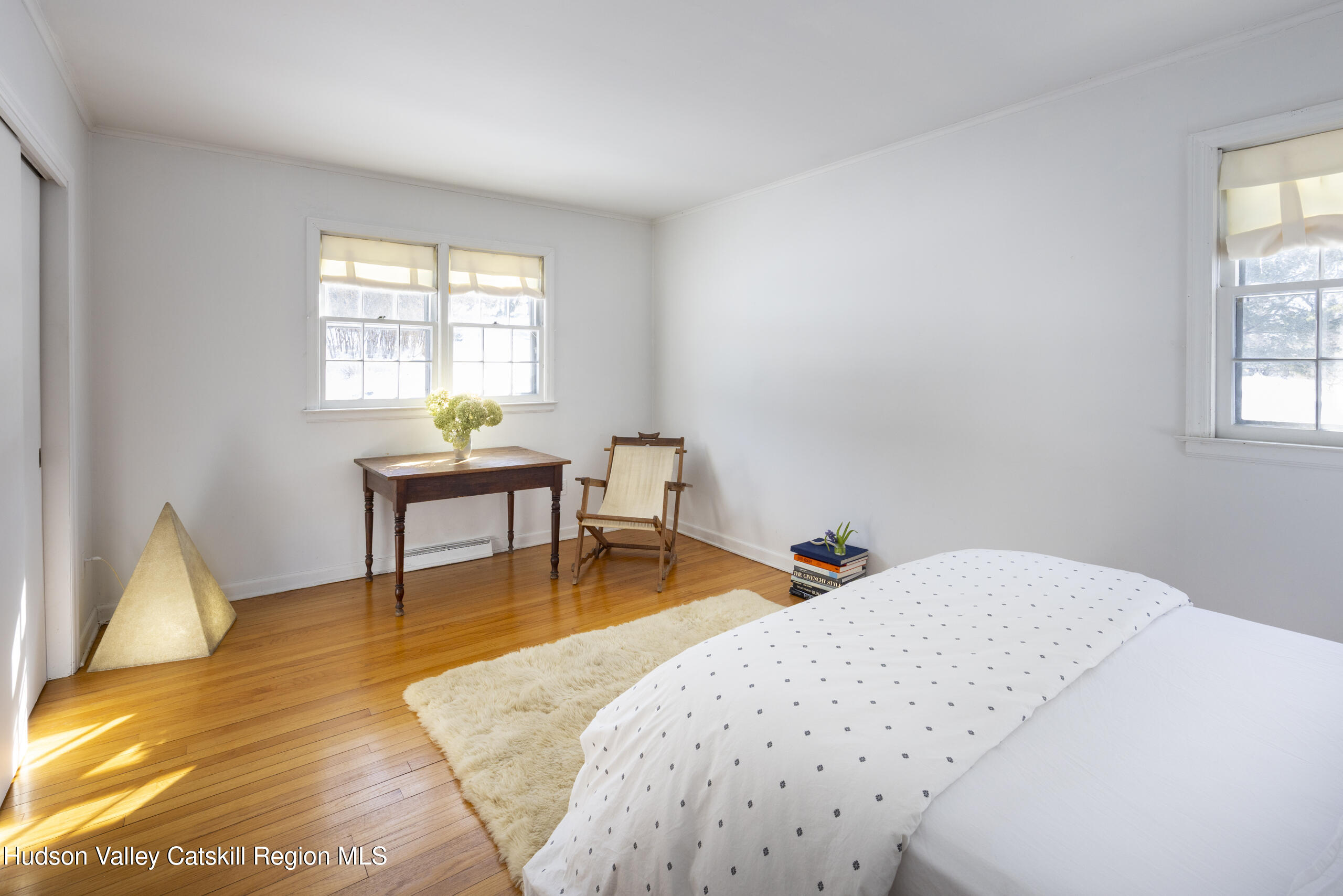 188 Mt Merino Road Hudson, NY 12534 - Photo 16 of 37 a bedroom with a bed and a table