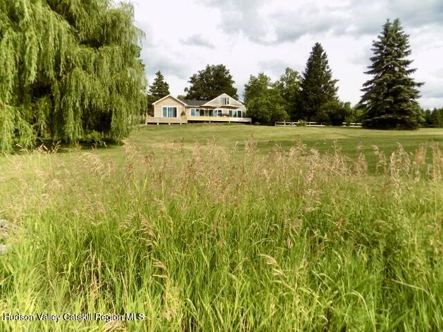 188 Mt Merino Road Hudson, NY 12534 - Photo 2 of 37 a view of a swimming pool with an outdoor space and seating area
