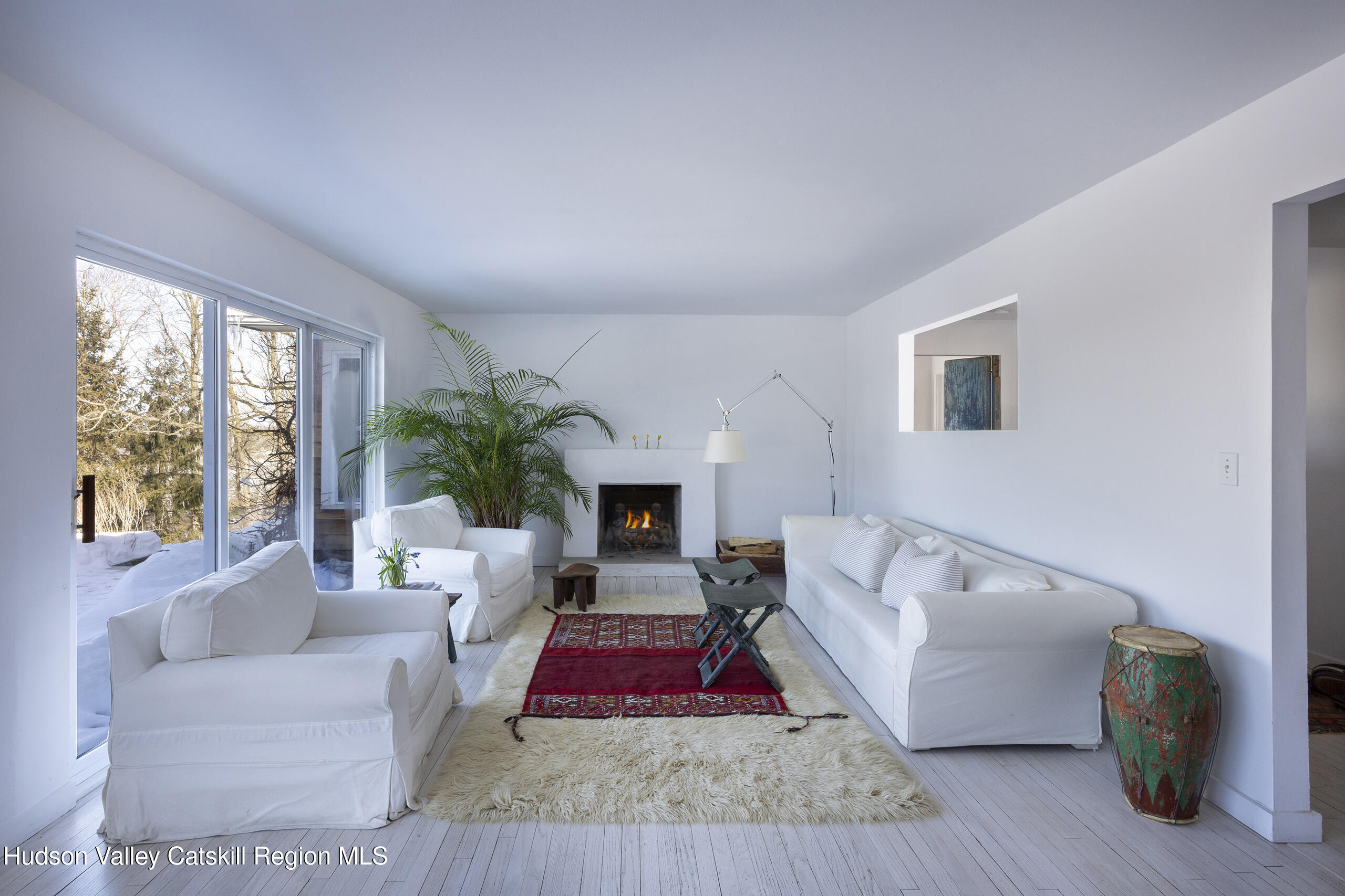 188 Mt Merino Road Hudson, NY 12534 - Photo 23 of 37 a living room with furniture and a fireplace