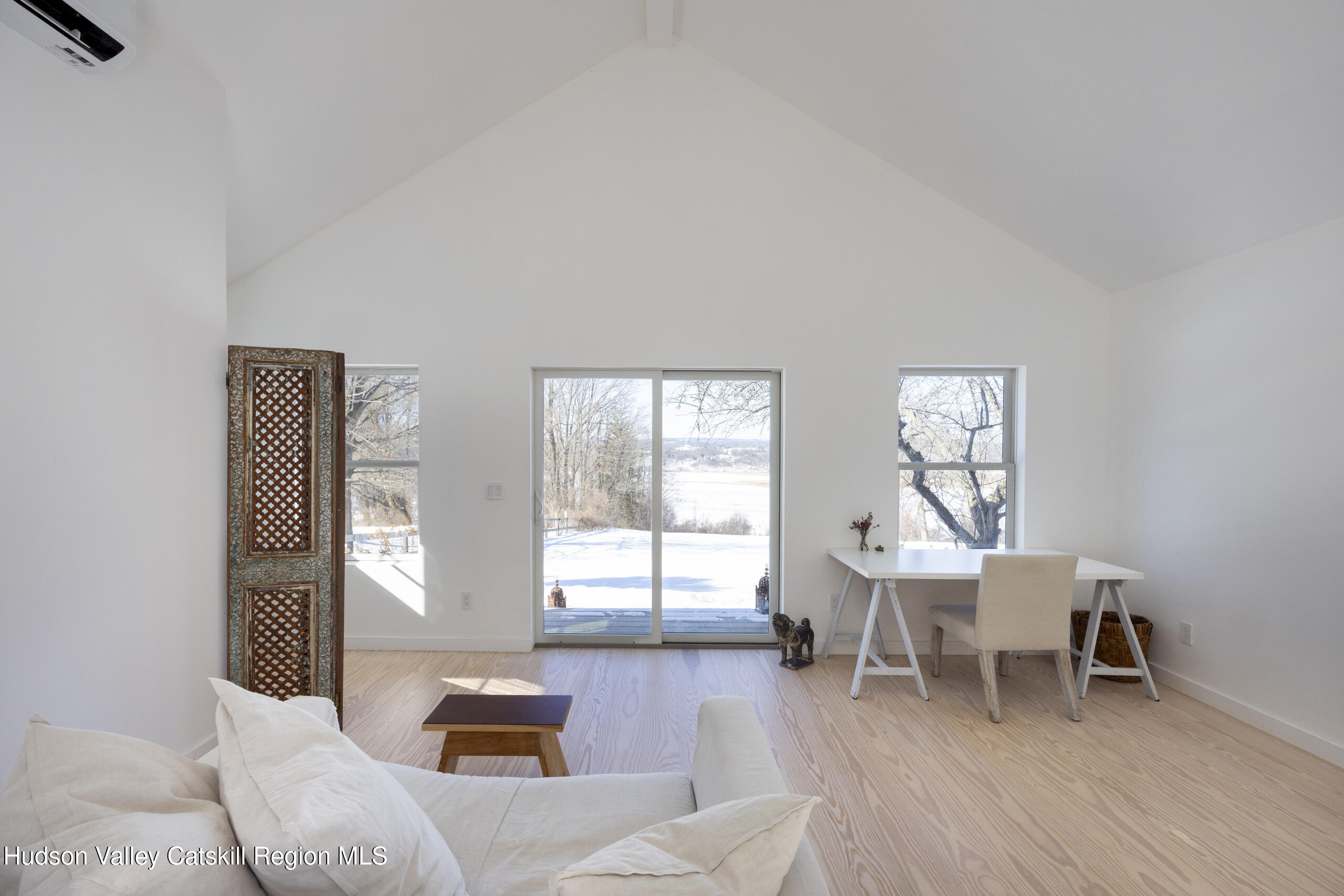 188 Mt Merino Road Hudson, NY 12534 - Photo 26 of 37 a living room with furniture and a large window