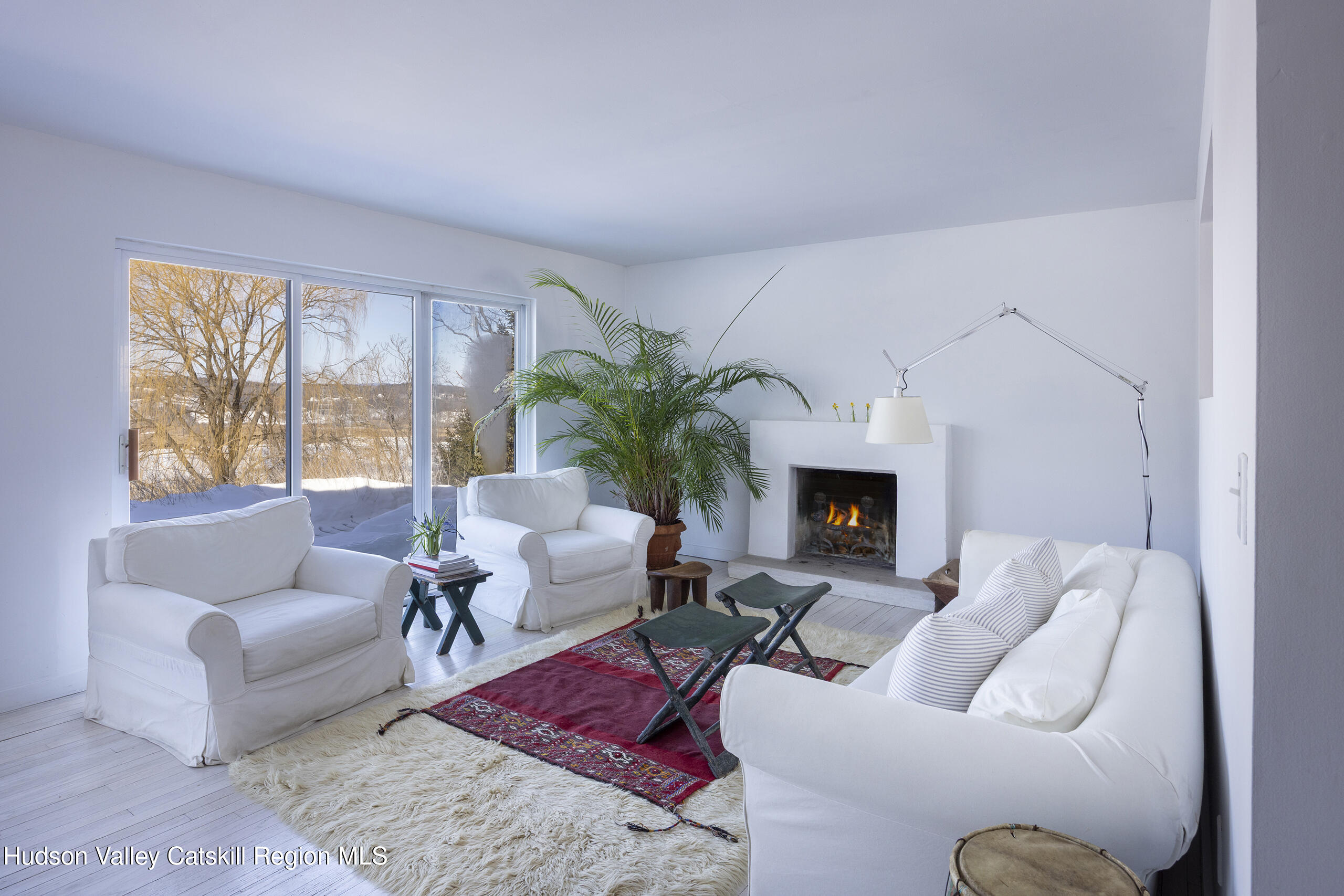 188 Mt Merino Road Hudson, NY 12534 - Photo 7 of 37 a living room with furniture and a fireplace