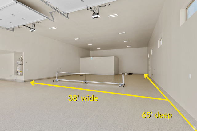 2955 East Rimrunner Drive St. George, UT 84790 - Photo 3 of 35 Expansive garage space with a light-colored, speckled epoxy floor