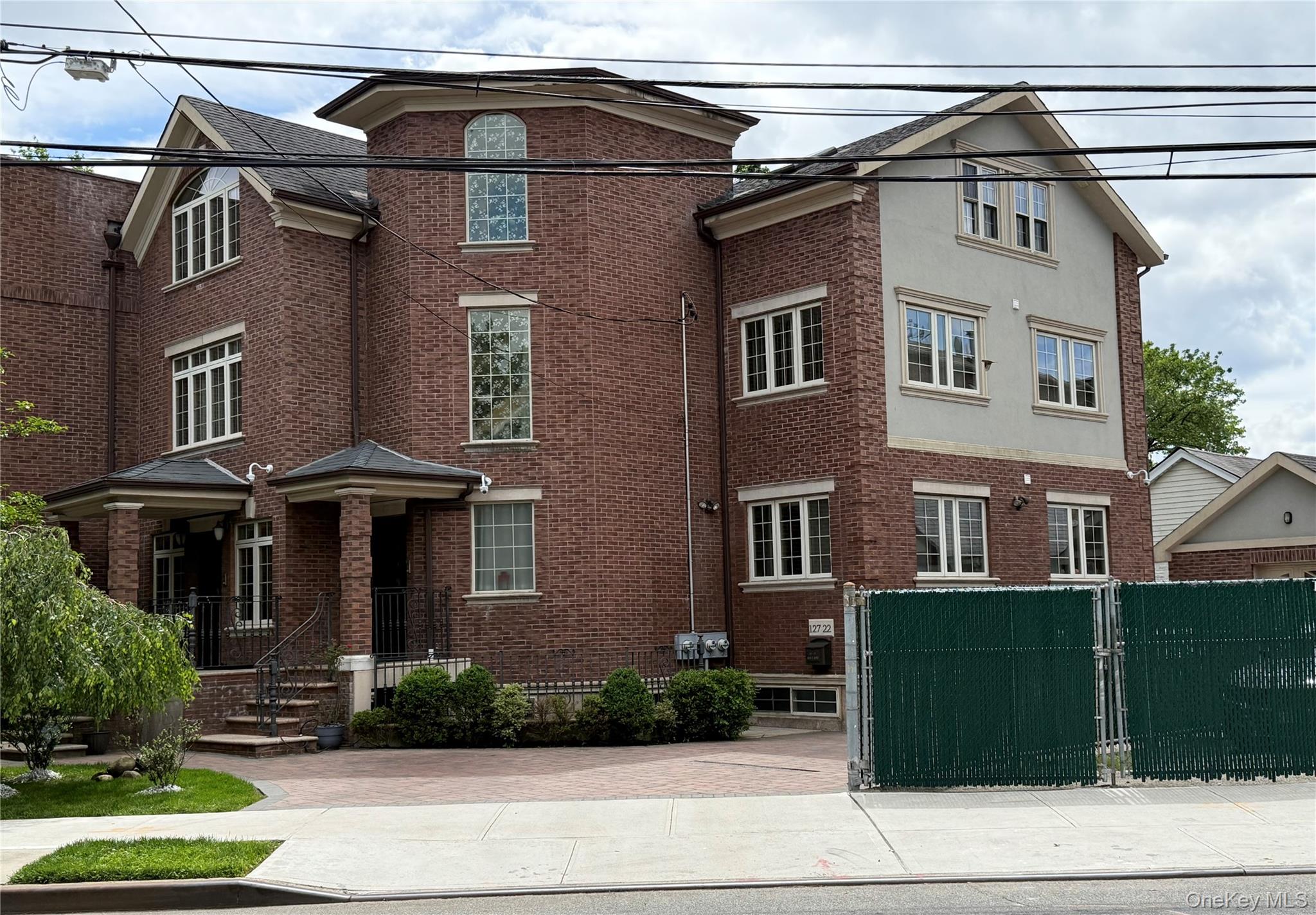 a view of a building with a yard