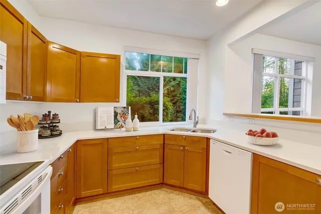a kitchen with a stove microwave and sink