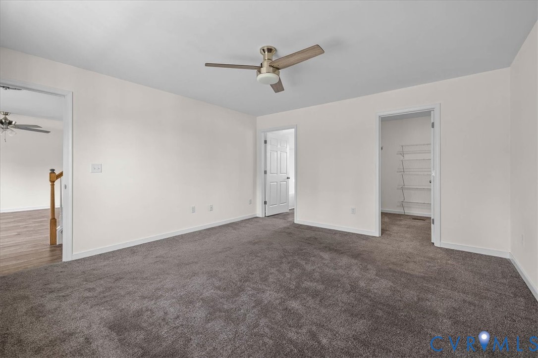 11325 Webb Road Disputanta, VA 23842 - Photo 12 of 32 a view of a livingroom with a ceiling fan and window