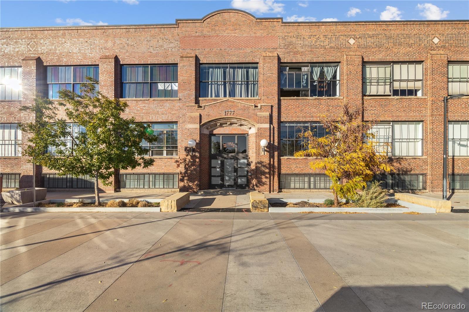 1777 East 39th Avenue, Unit 205 Denver, CO 80205 - Photo 11 of 13 a view of a building with a street