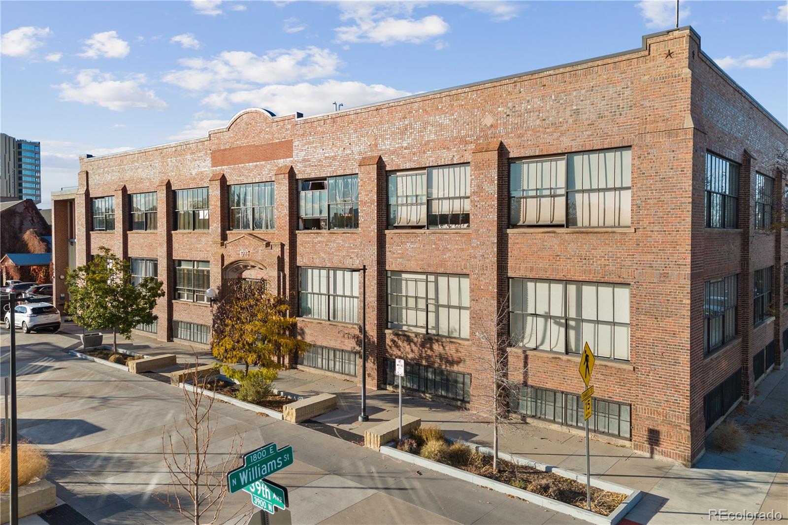 1777 East 39th Avenue, Unit 205 Denver, CO 80205 - Photo 12 of 13 a front view of a building with glass windows and ceiling fan