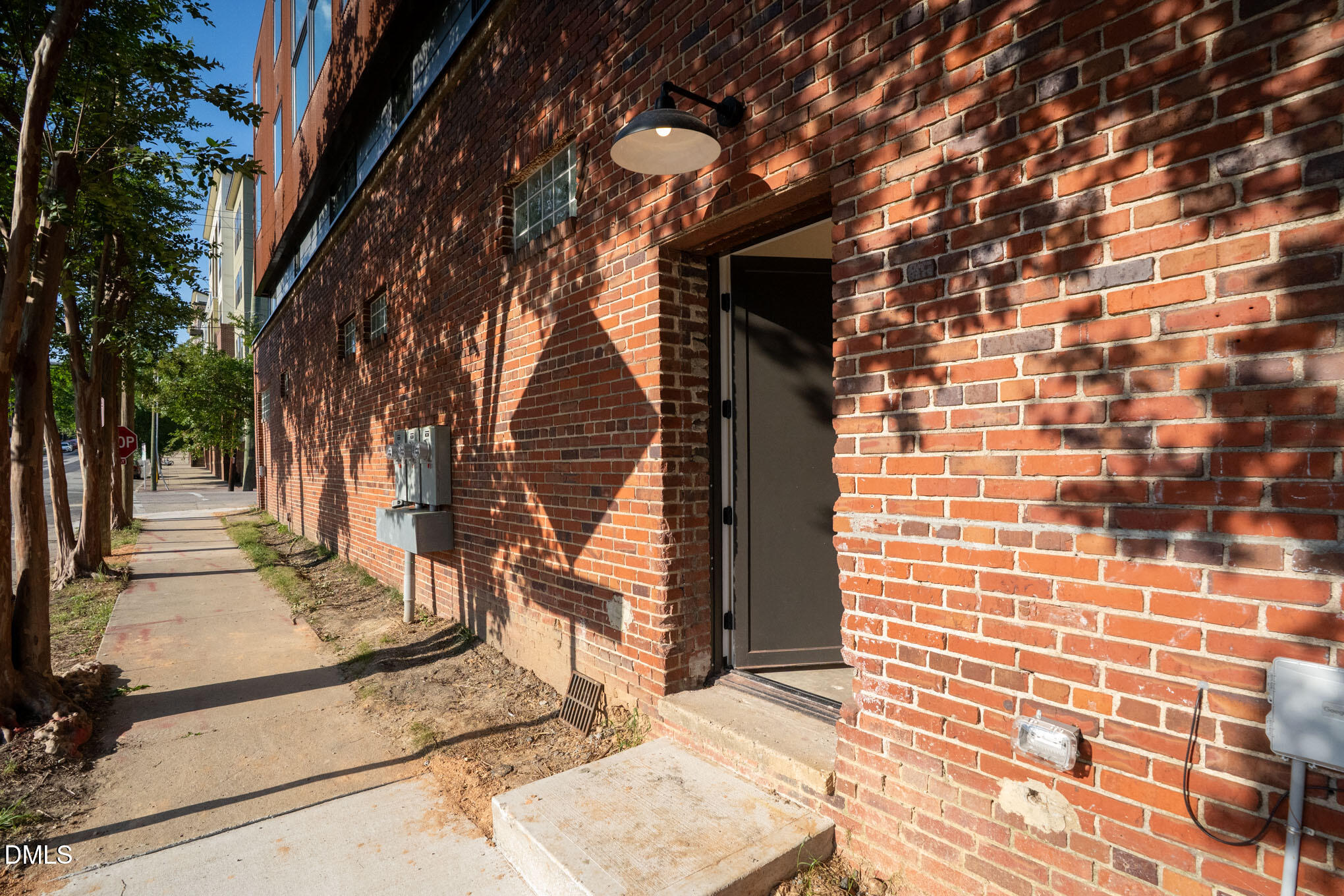 400 East Martin Street, Unit A Raleigh, NC 27601 - Photo 27 of 29 a view of a pathway both side of building