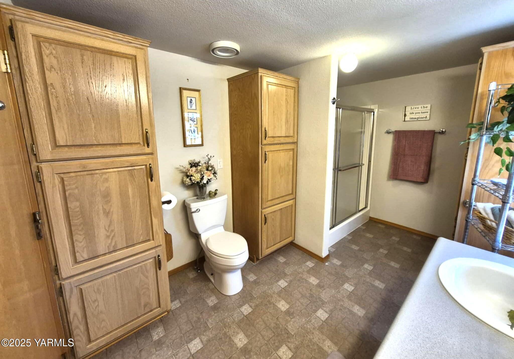 2490 Thompson Road Cowiche, WA 98923 - Photo 45 of 62 a bathroom with a sink a toilet and a shower