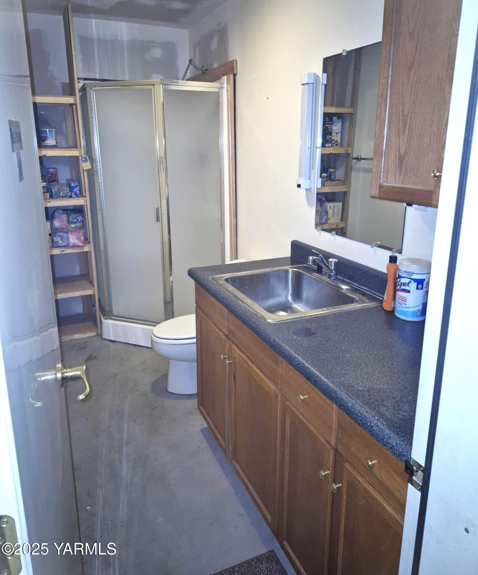 2490 Thompson Road Cowiche, WA 98923 - Photo 59 of 62 a bathroom with a granite countertop sink a toilet and shower