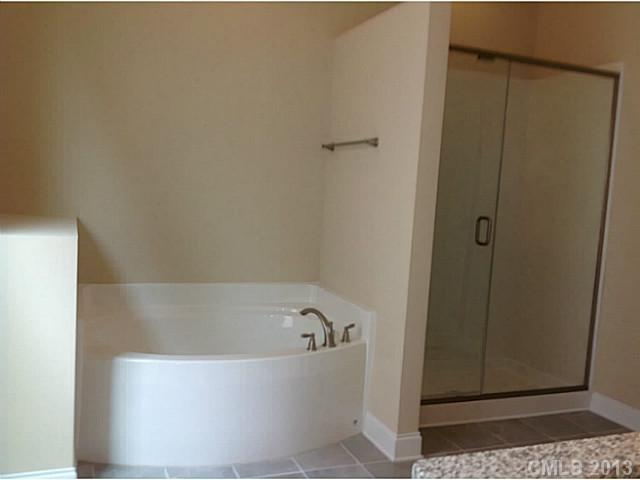 78026 Rillstone Drive, Unit 186 Lancaster, SC 29720 - Photo 13 of 13 a bathroom with a bathtub