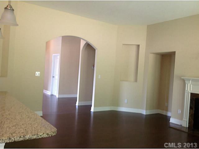 78026 Rillstone Drive, Unit 186 Lancaster, SC 29720 - Photo 9 of 13 a view of a hallway with wooden floor