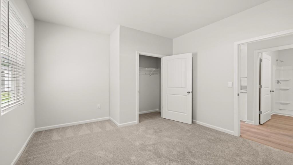 101 Hill Side Road Dallas, GA 30157 - Photo 12 of 31 an empty room with windows and closet
