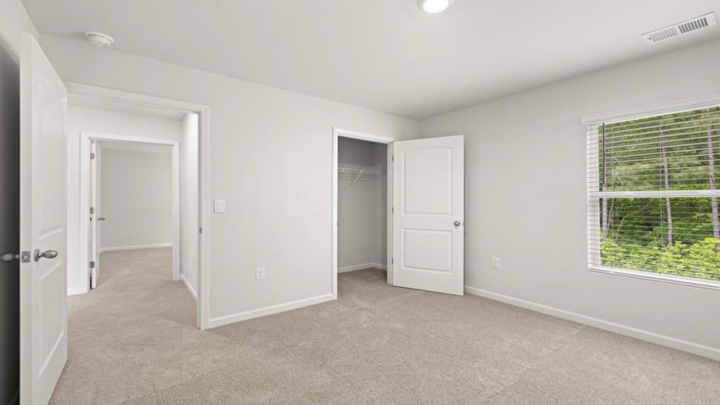 101 Hill Side Road Dallas, GA 30157 - Photo 23 of 31 an empty room with windows and closet