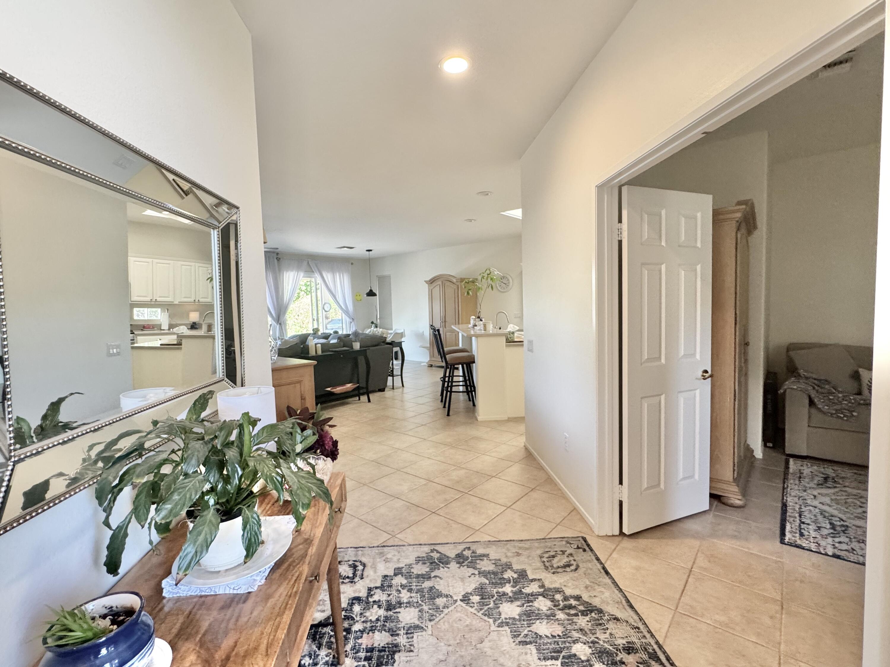 78322 Vinewood Drive Palm Desert, CA 92211 - Photo 14 of 30 a living room with furniture and a table