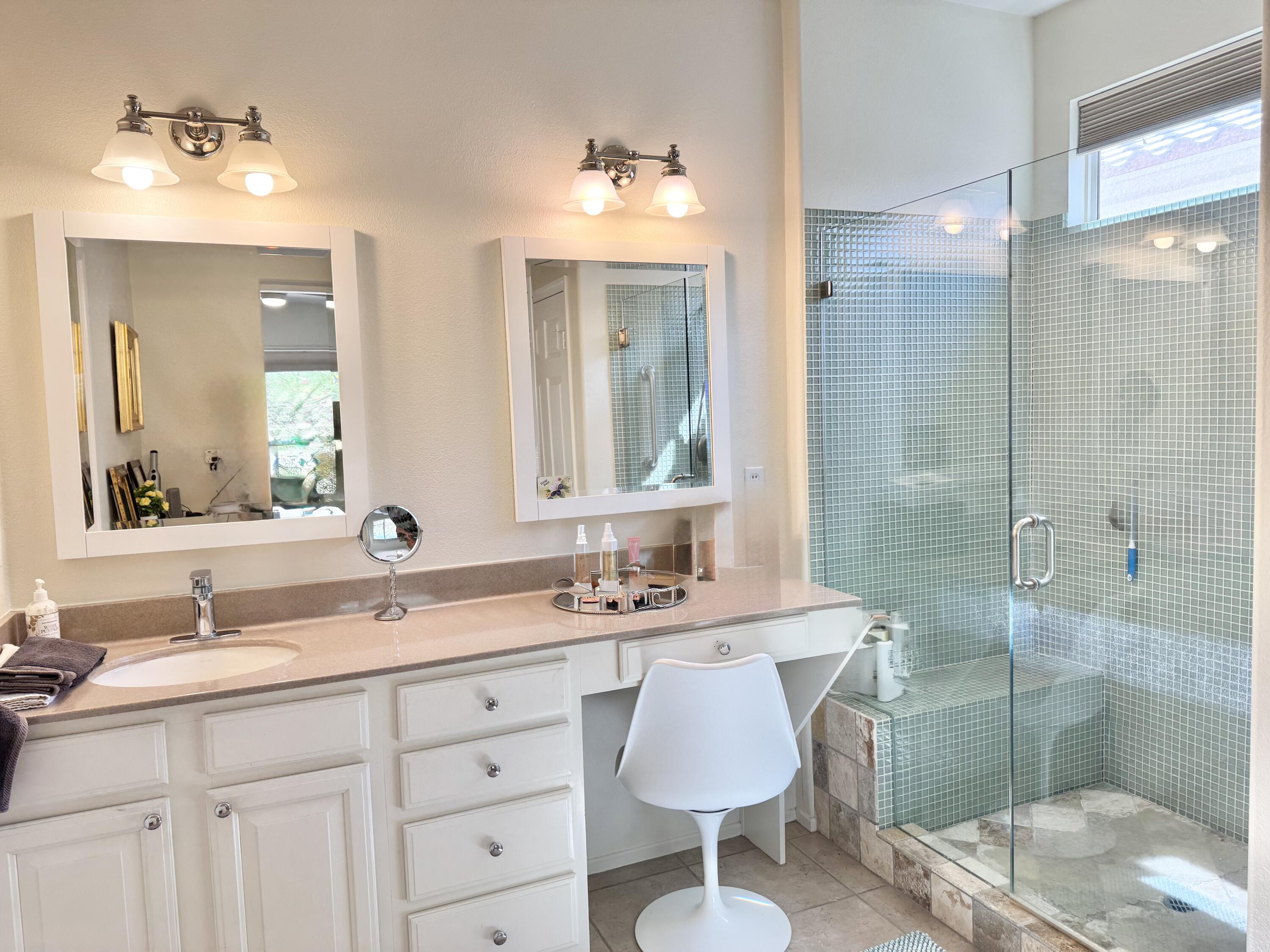 78322 Vinewood Drive Palm Desert, CA 92211 - Photo 17 of 30 a bathroom with a double vanity sink mirror and shower