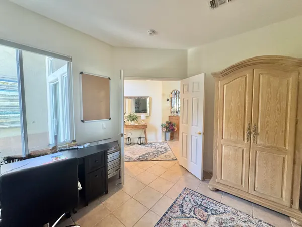 a large bathroom with a glass door shower and sink