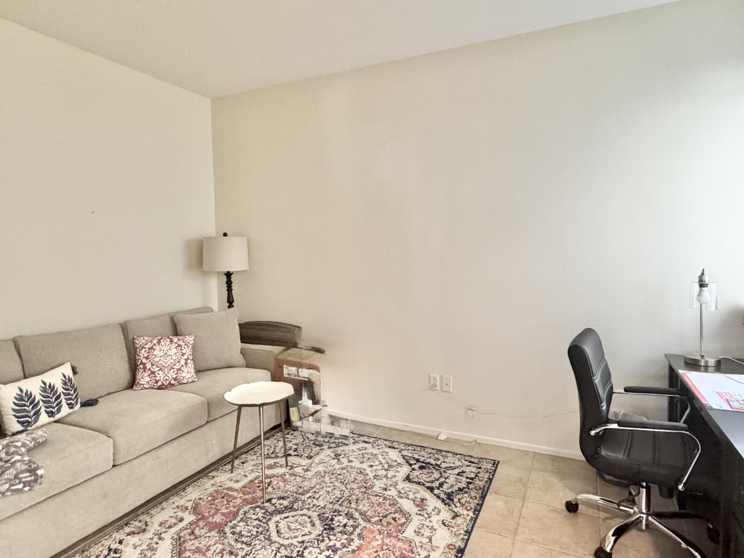 78322 Vinewood Drive Palm Desert, CA 92211 - Photo 20 of 30 a living room with furniture and a rug