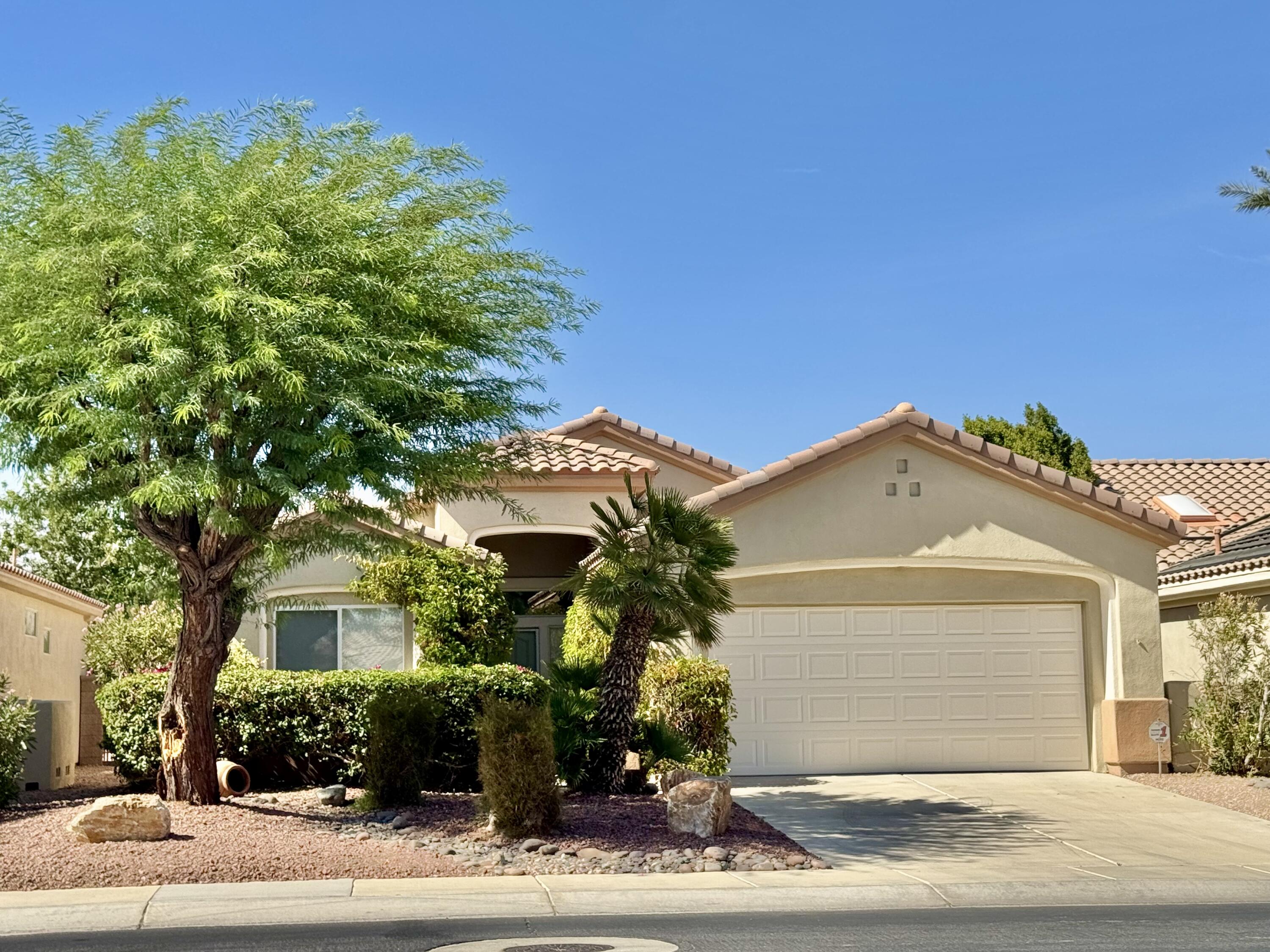 78322 Vinewood Drive Palm Desert, CA 92211 - Photo 2 of 30 front view of a house with a street