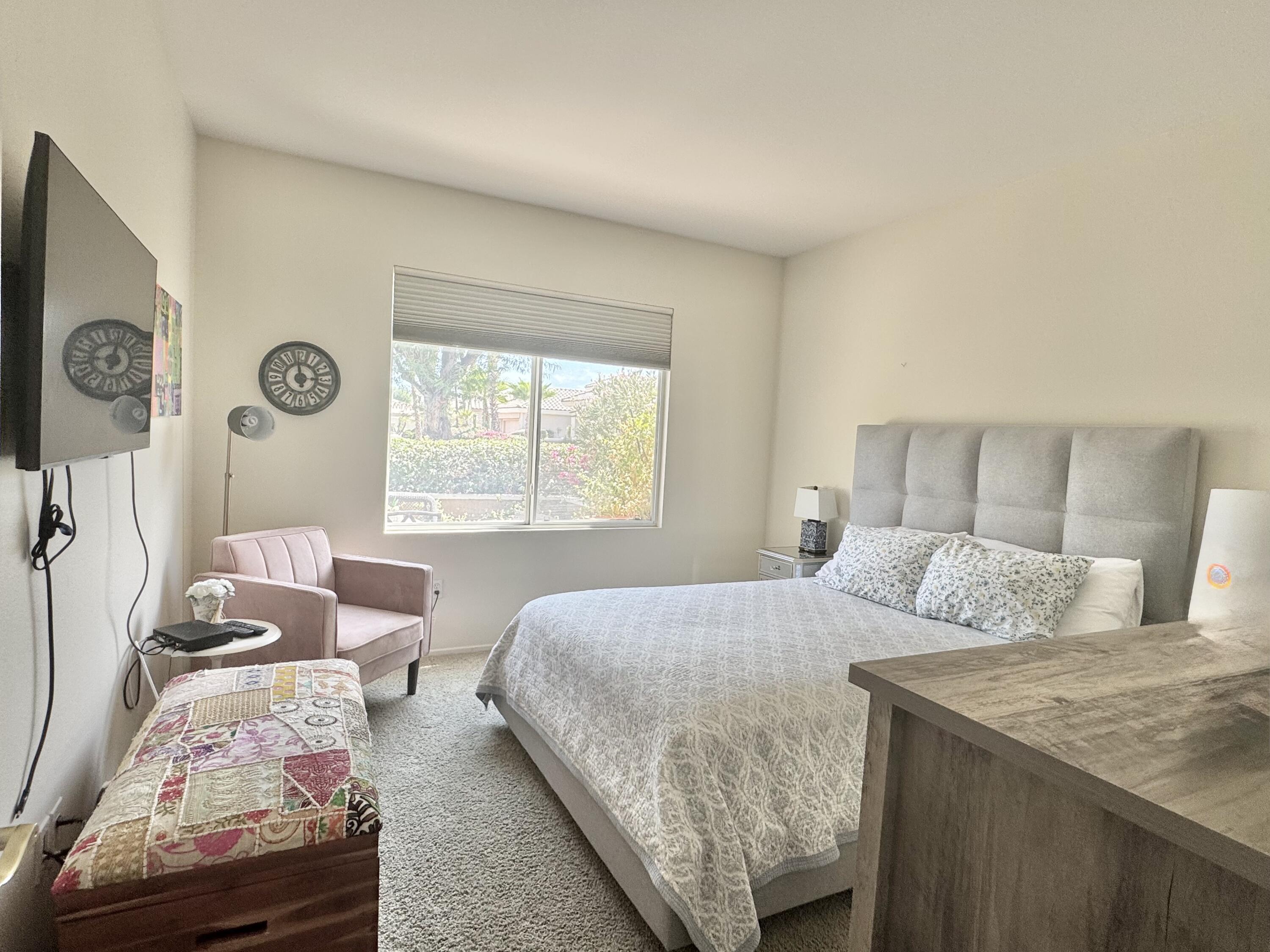 78322 Vinewood Drive Palm Desert, CA 92211 - Photo 22 of 30 a bedroom with a bed and a window