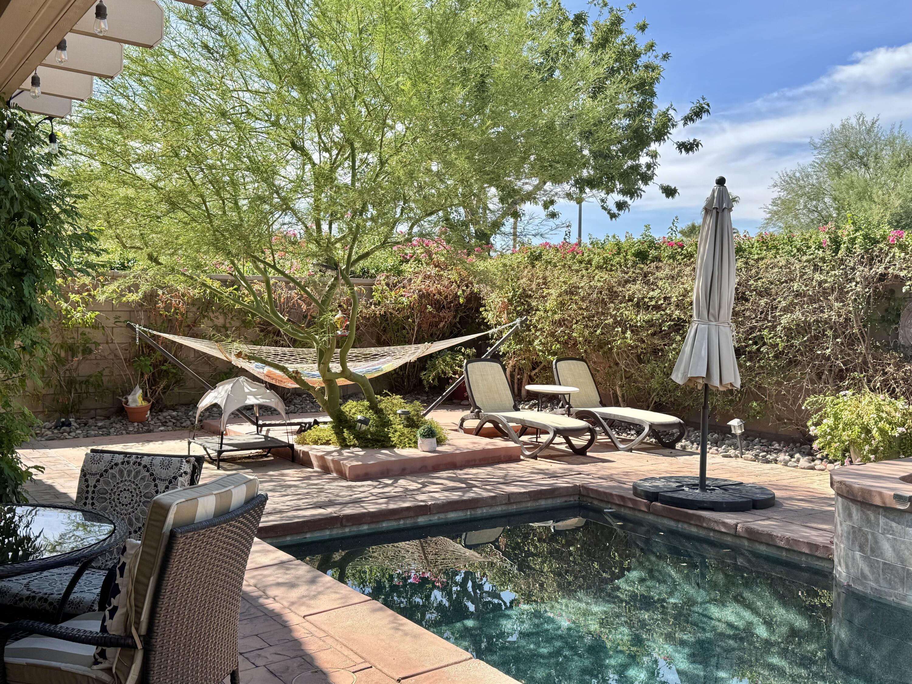 78322 Vinewood Drive Palm Desert, CA 92211 - Photo 6 of 30 a view of a house with backyard and sitting area