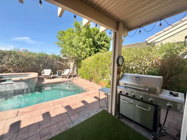 a view of a patio with a yard
