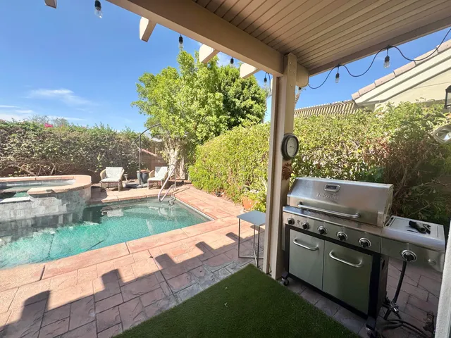 a view of a patio with a yard
