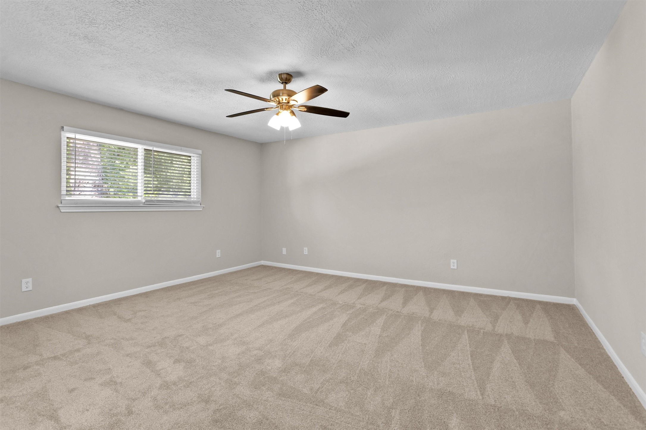 9115 Godstone Lane Spring, TX 77379 - Photo 22 of 46 This expansive primary suite offers ample space to effortlessly accommodate all your oversized bedroom furniture, creating the perfect retreat.
