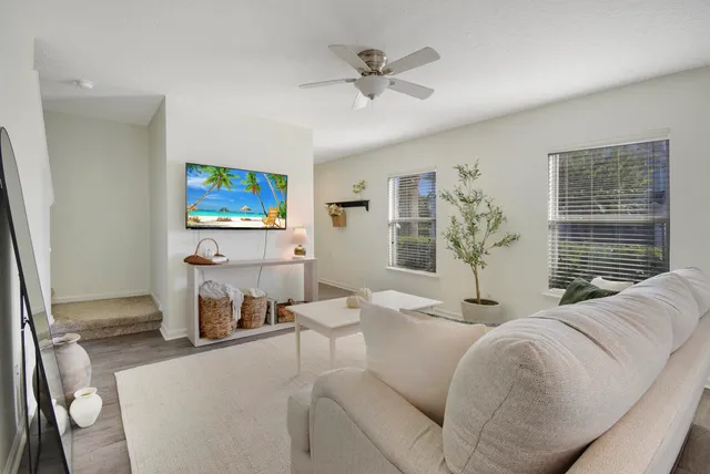 a kitchen with stainless steel appliances granite countertop a refrigerator a stove top oven a sink and dishwasher