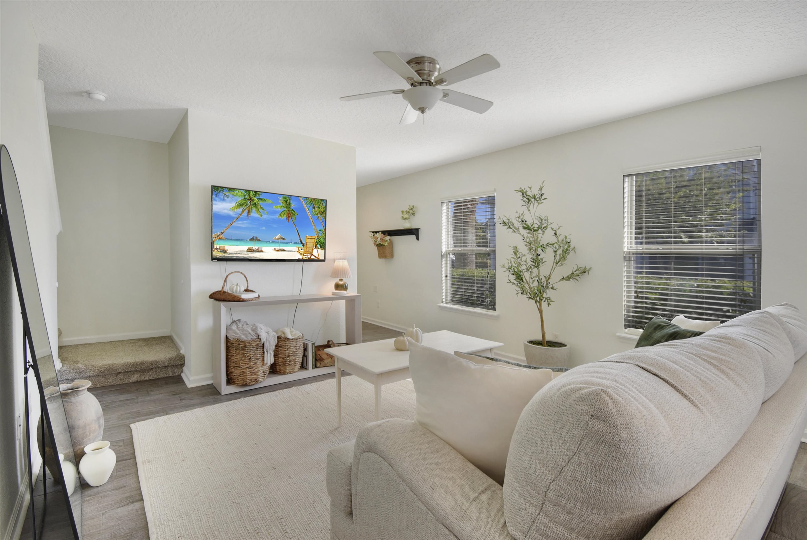 323 Islander Circle St. Augustine, FL 32080 - Photo 11 of 36 a living room with furniture and a flat screen tv