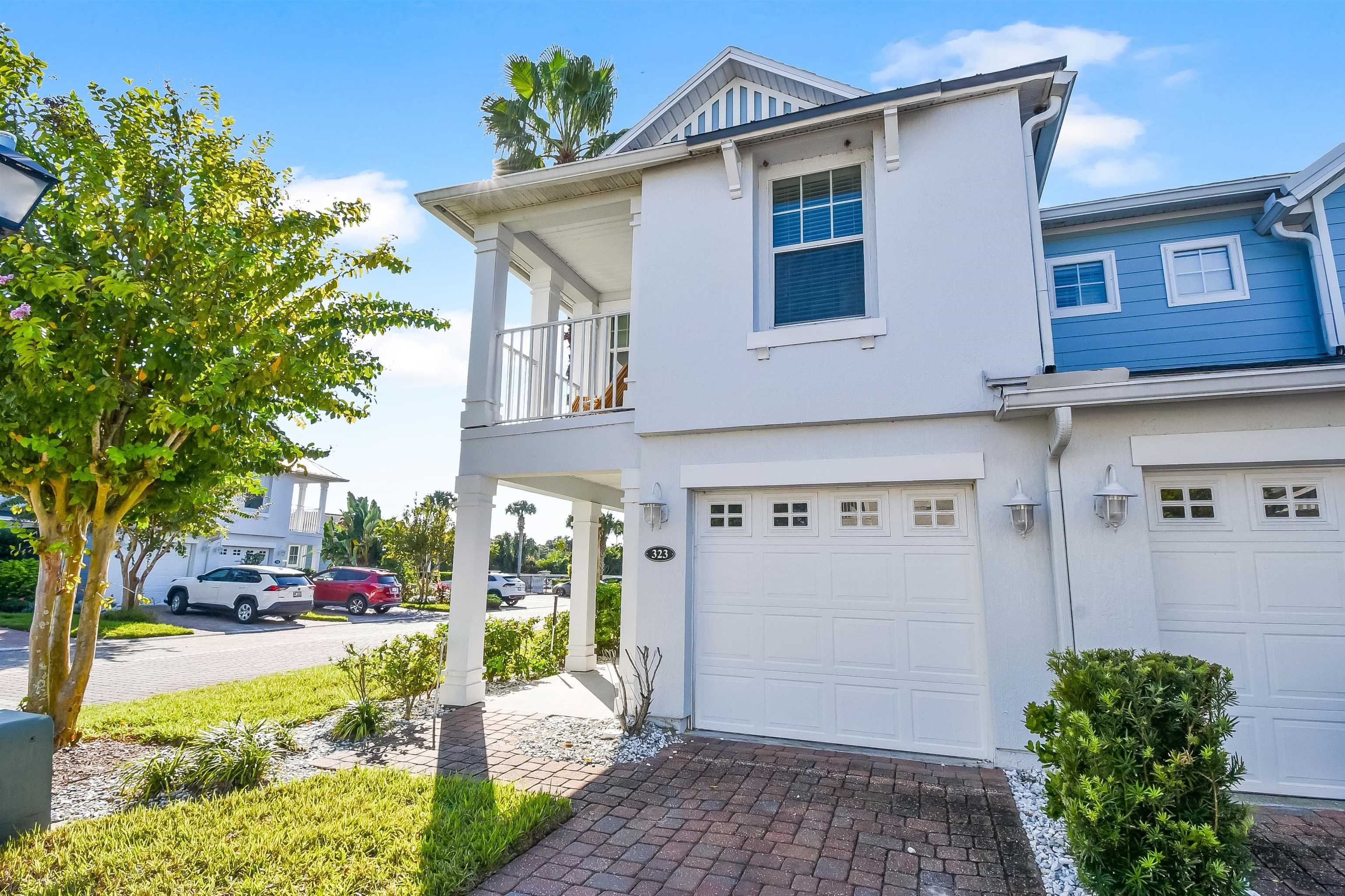 323 Islander Circle St. Augustine, FL 32080 - Photo 2 of 36 a view of a street with cars parked on the road