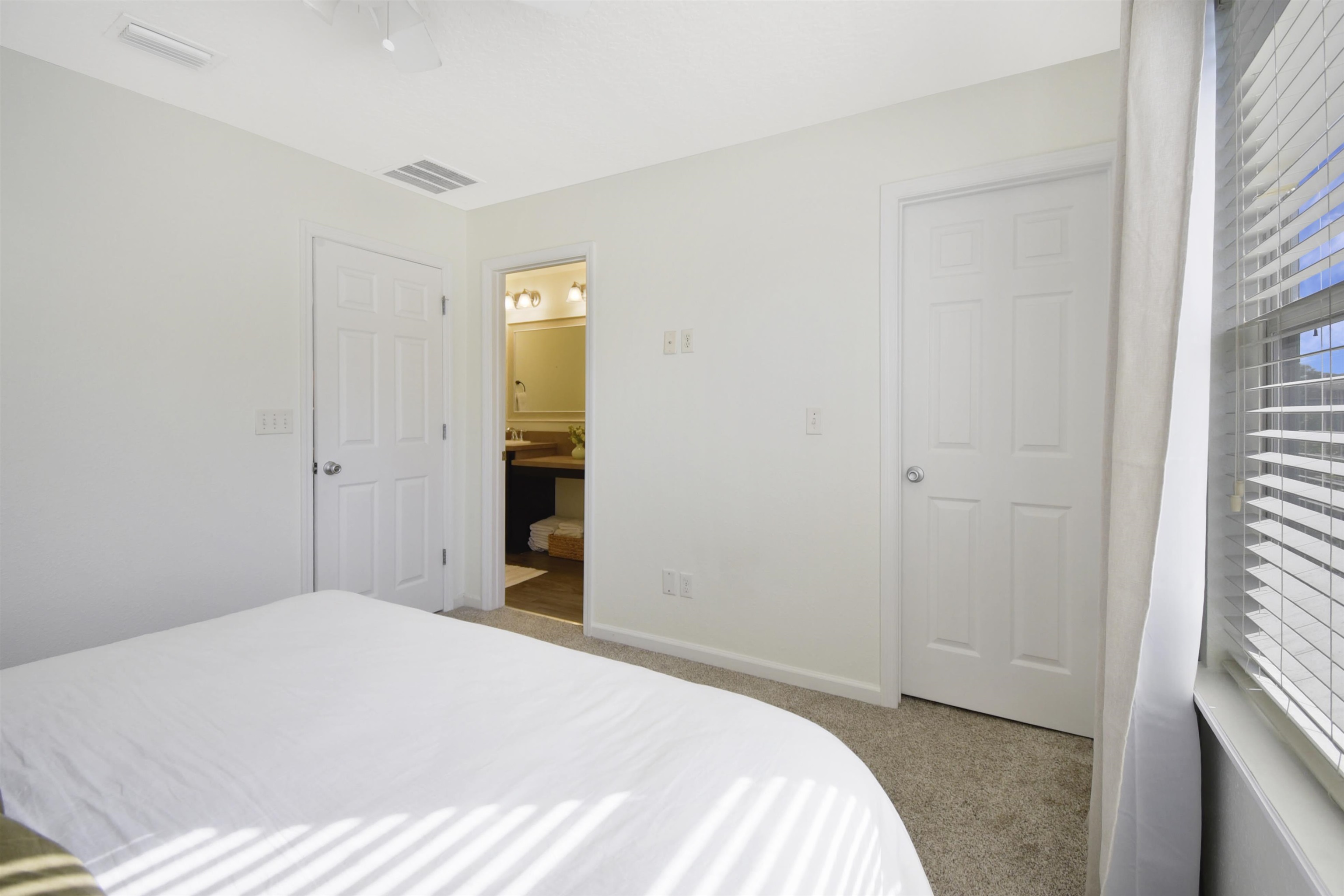 323 Islander Circle St. Augustine, FL 32080 - Photo 22 of 36 a bedroom with a bed and a window