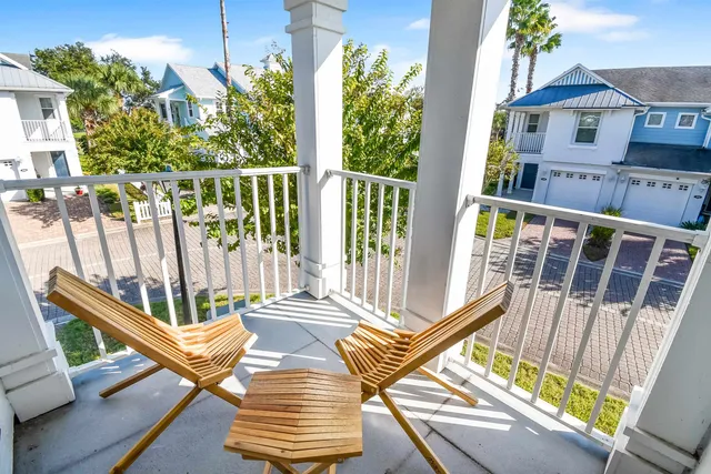 a view of a patio with table and chairs and potted plants