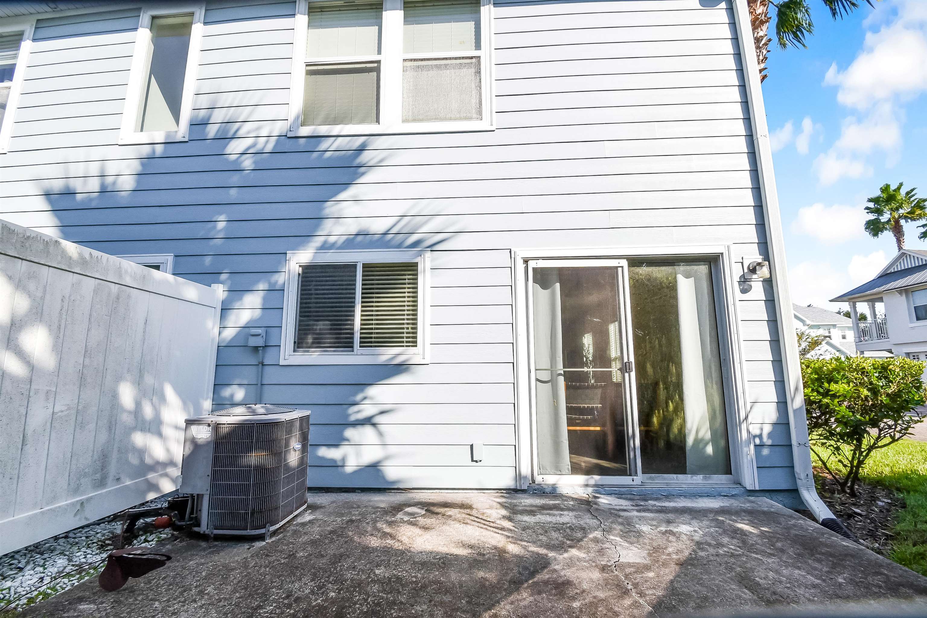 323 Islander Circle St. Augustine, FL 32080 - Photo 31 of 36 a view of a patio with table and chairs and potted plants
