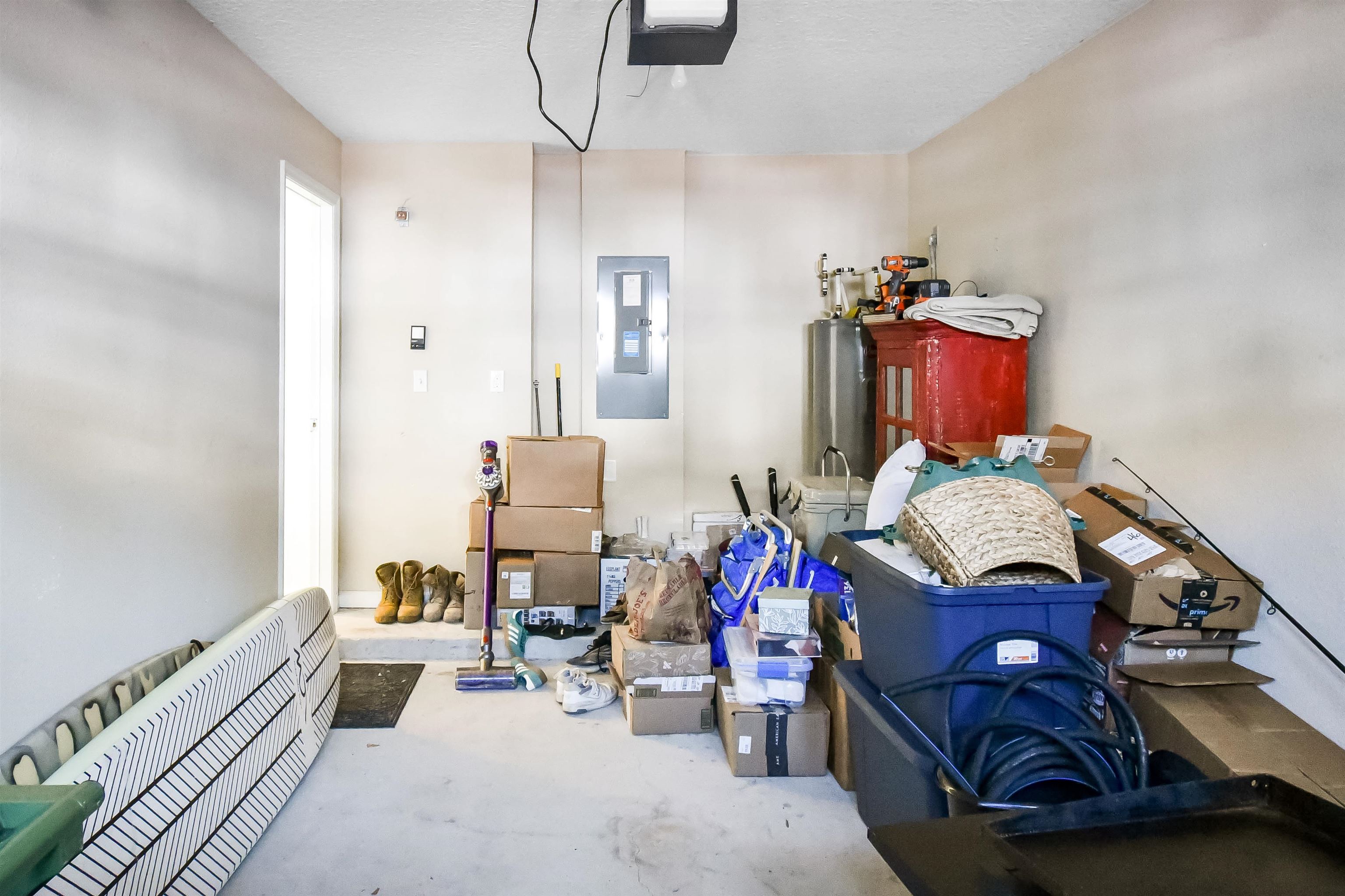 323 Islander Circle St. Augustine, FL 32080 - Photo 32 of 36 a bedroom with furniture and a chandelier