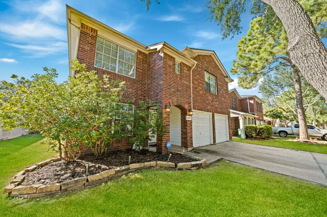 a view of a building with a yard