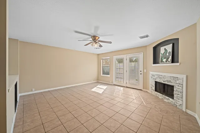 a view of an empty room with a fireplace