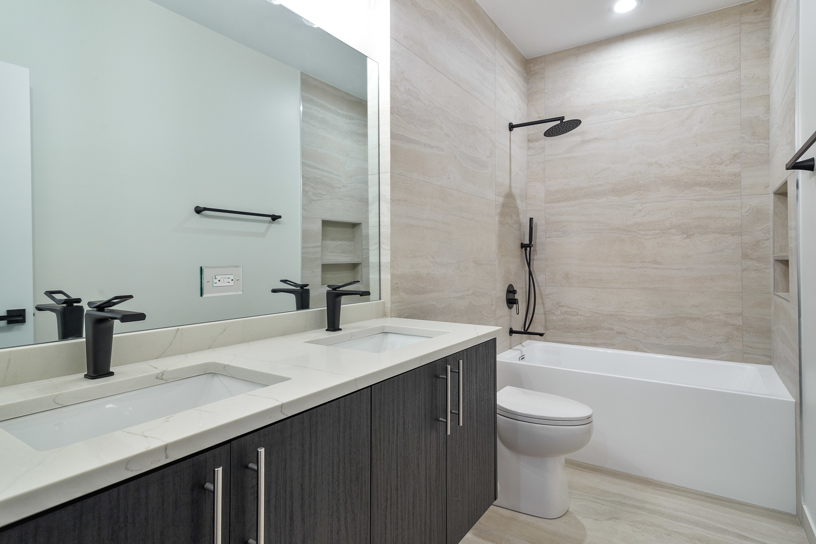 3015 North Normandy Avenue Chicago, IL 60634 - Photo 15 of 28 a bathroom with a sink a toilet and shower