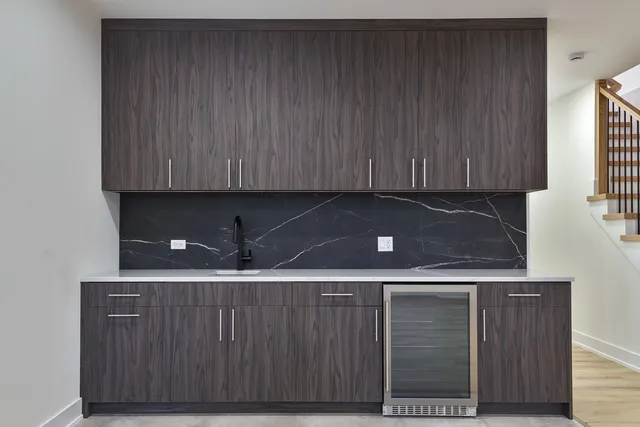 a kitchen with a sink and cabinets