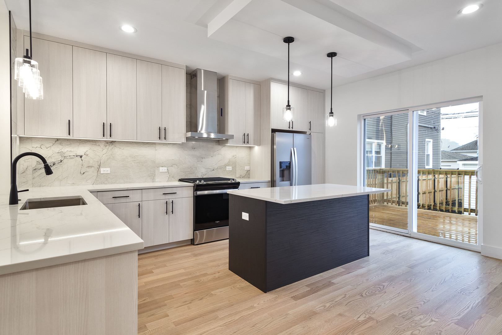 3015 North Normandy Avenue Chicago, IL 60634 - Photo 2 of 28 a kitchen with stainless steel appliances granite countertop a sink a stove and a refrigerator