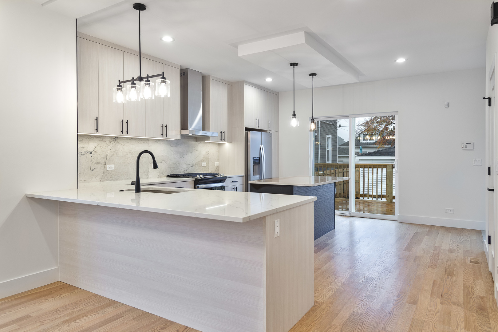 3015 North Normandy Avenue Chicago, IL 60634 - Photo 5 of 28 a kitchen with counter top space sink and refrigerator