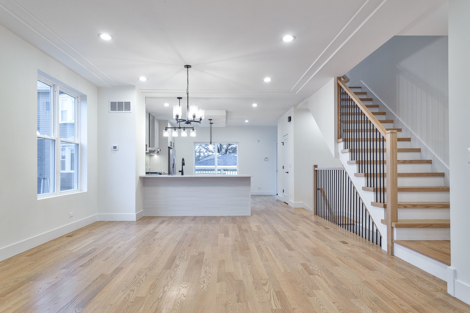 3015 North Normandy Avenue Chicago, IL 60634 - Photo 7 of 28 a view of kitchen and hall with wooden floor